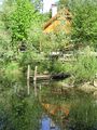 Steinschalerhof: das Teichhaus im Sommer]]